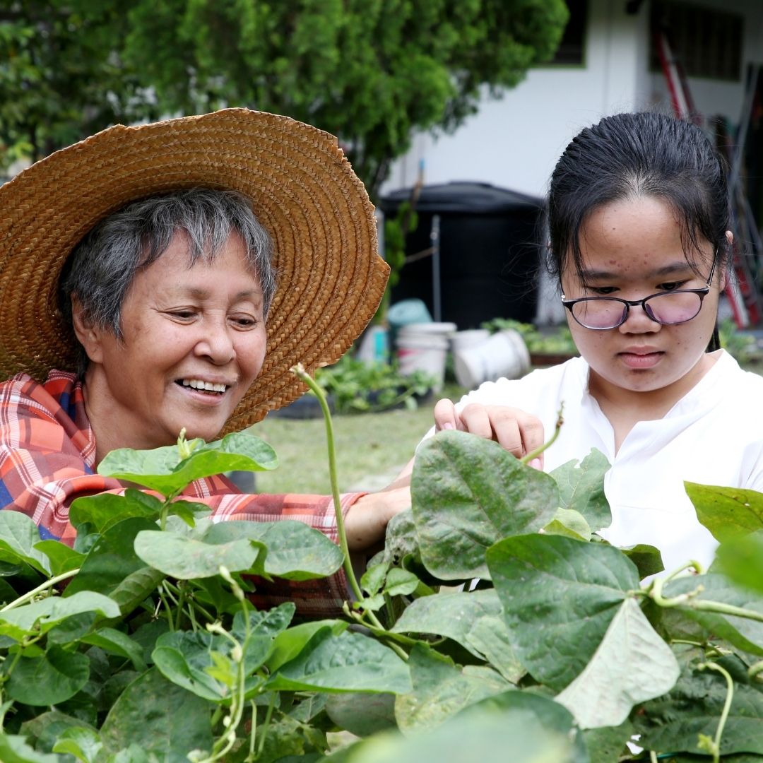 activities that impress colleges like this teen gardening with her grandmother