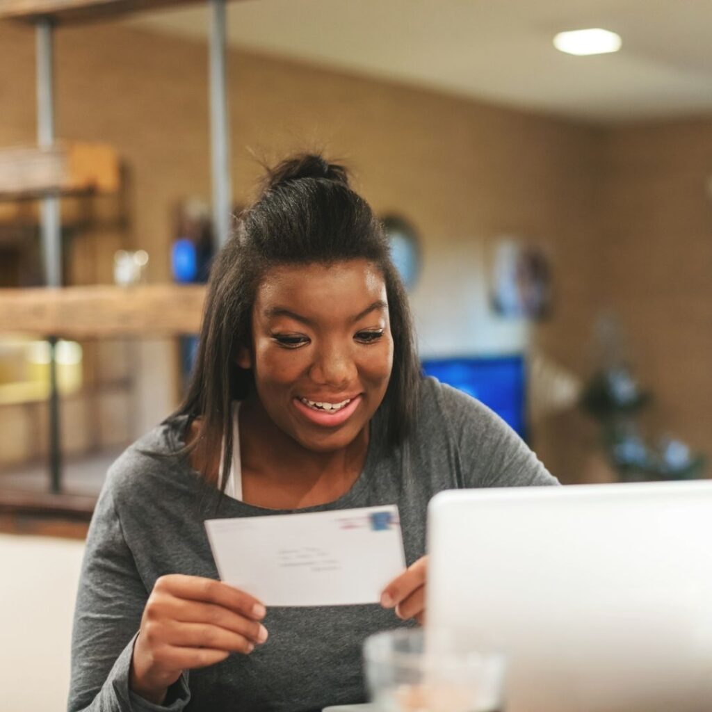 girl student getting her letter for college
