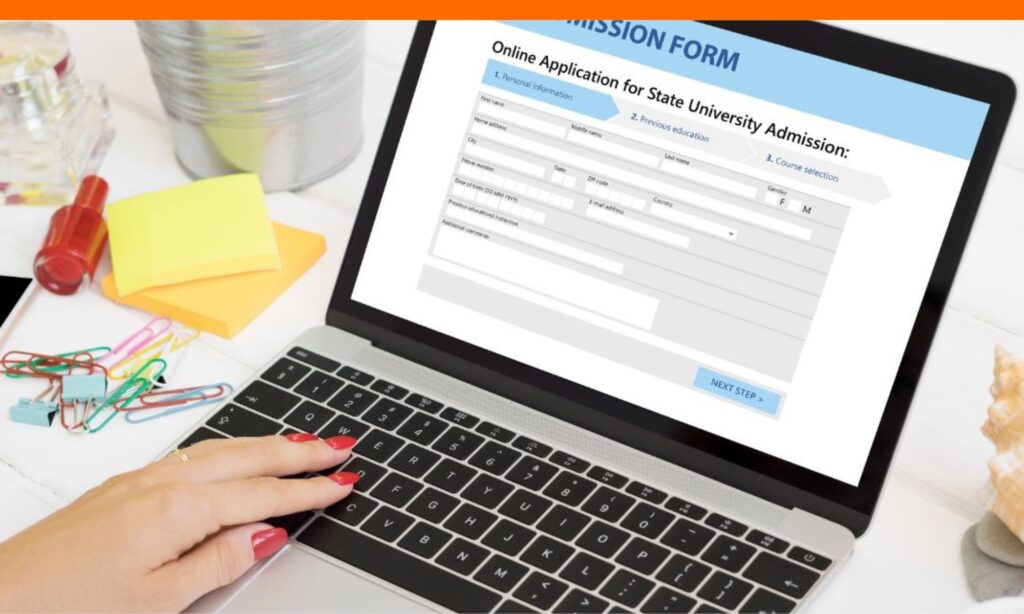 Student submitting college application on laptop