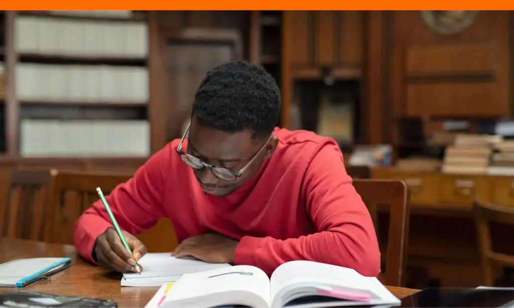 Teen boy studying for Indiana University Scholarship