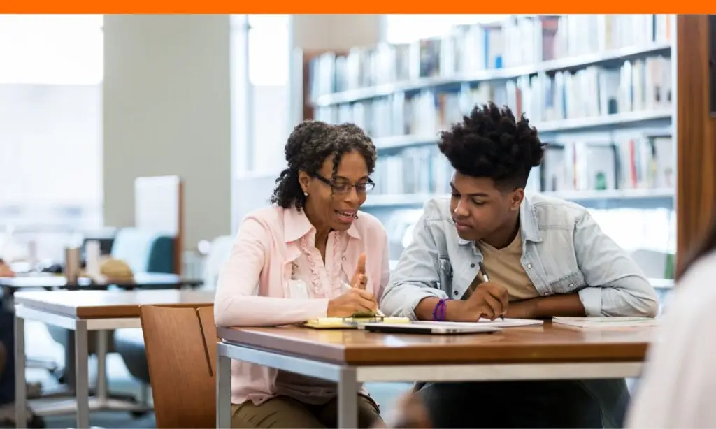 teen boy getting advise from counselor about washington scholarships