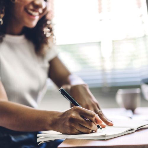 Student writing college essay, hoping she's part of MIT Acceptance Rate