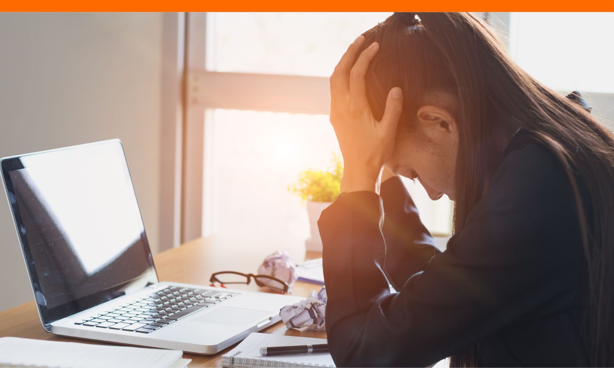 Stressed student working on college applications