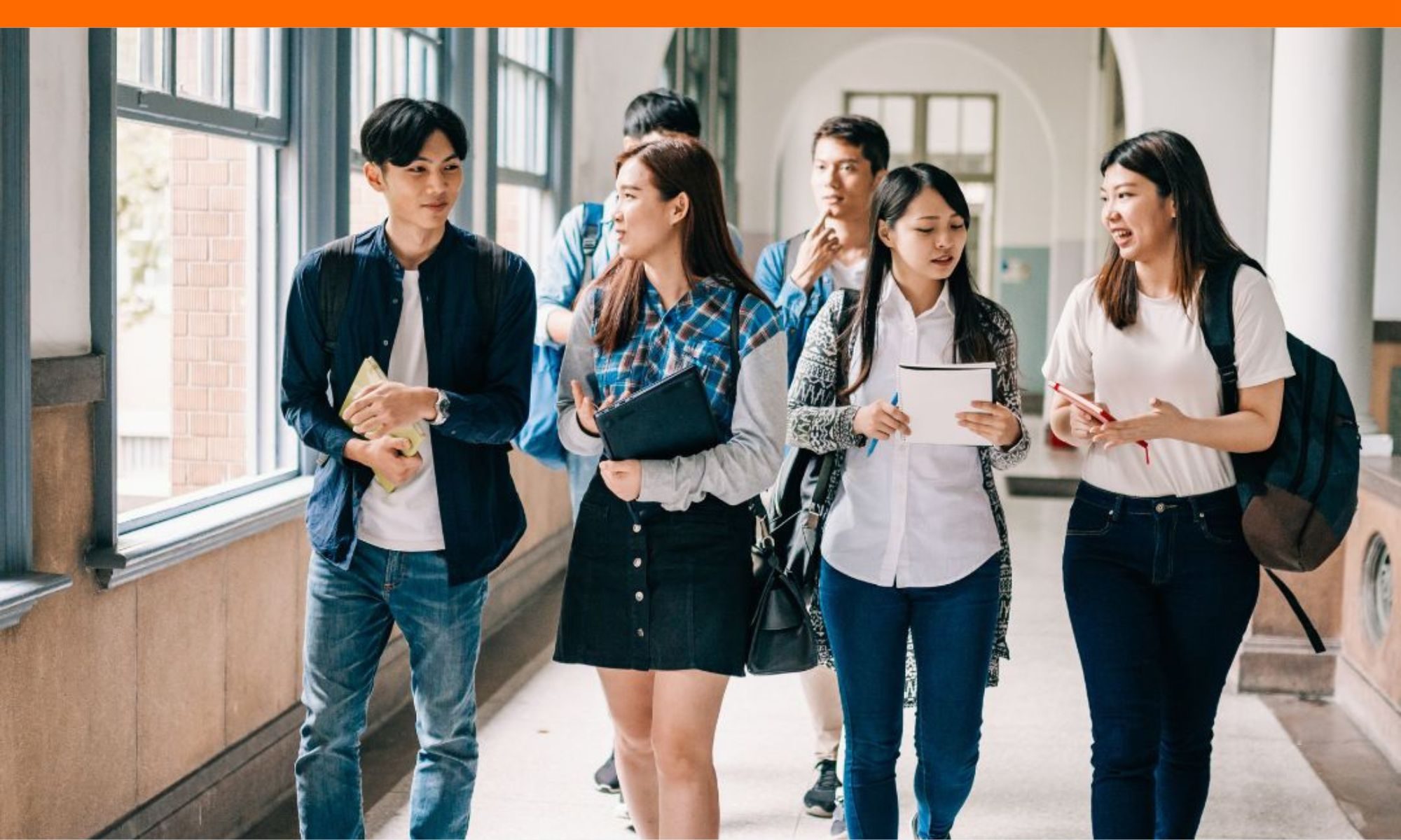 Students talking in school hallway